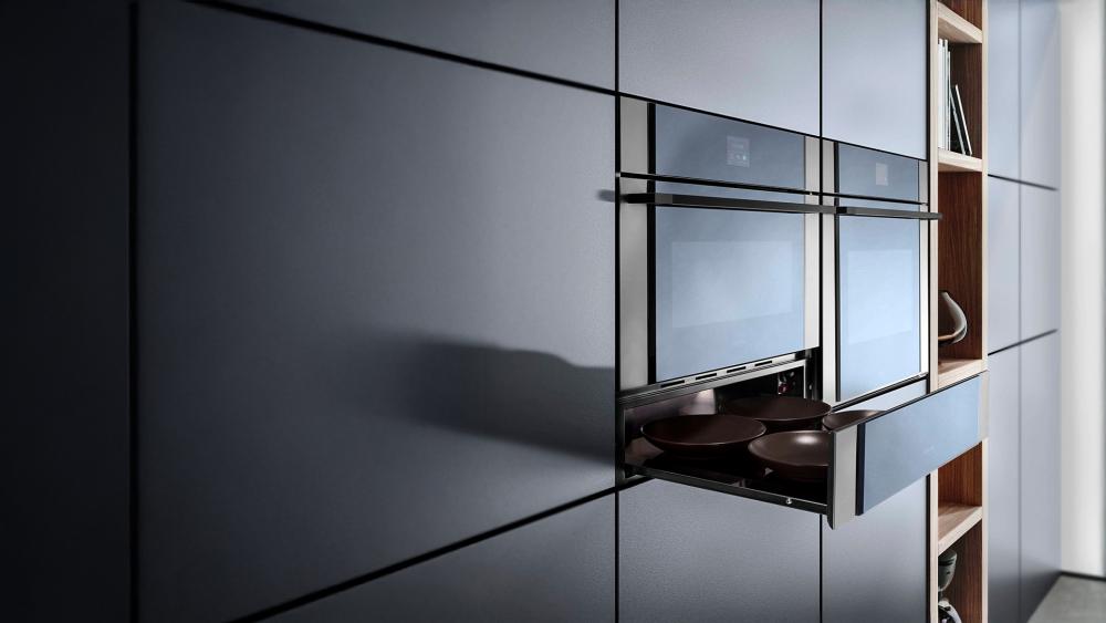 Built-in dish warmers providing even heat distribution to keep plates ready to serve, sleek, functional, and efficient design.